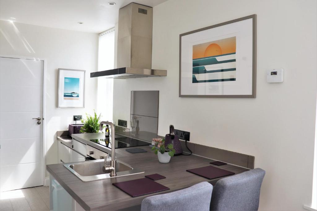 a kitchen with a sink and a counter top at Studio 5 in Woolacombe