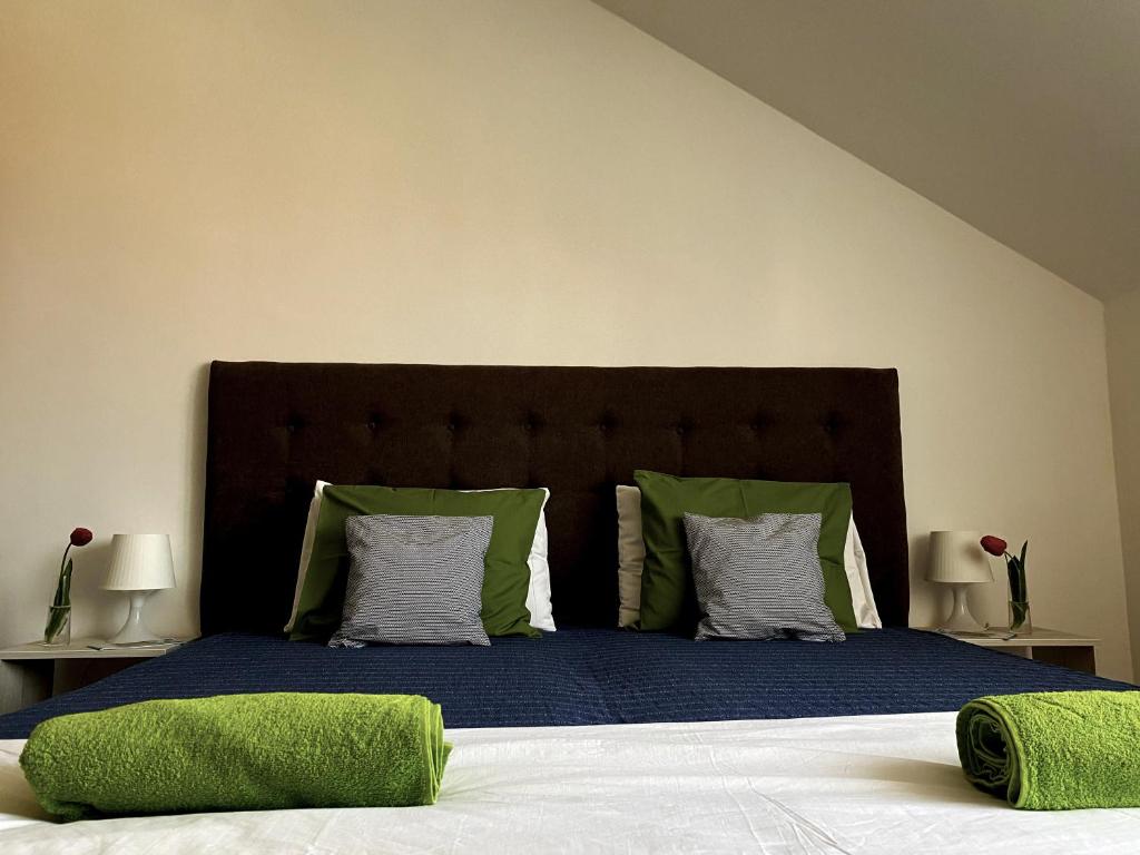 A bed or beds in a room at Bóbita Apartman