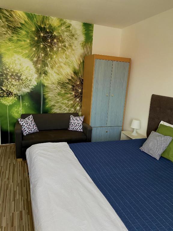 A bed or beds in a room at Bóbita Apartman