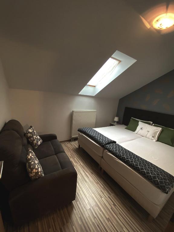 A bed or beds in a room at Bóbita Apartman