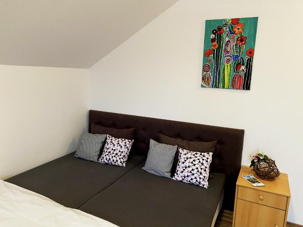 A bed or beds in a room at Bóbita Apartman