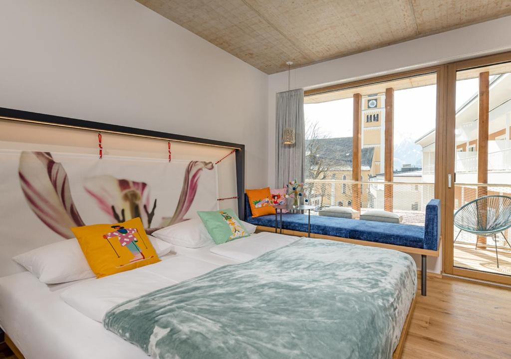 Postel nebo postele na pokoji v ubytování Hotel Blü Gastein