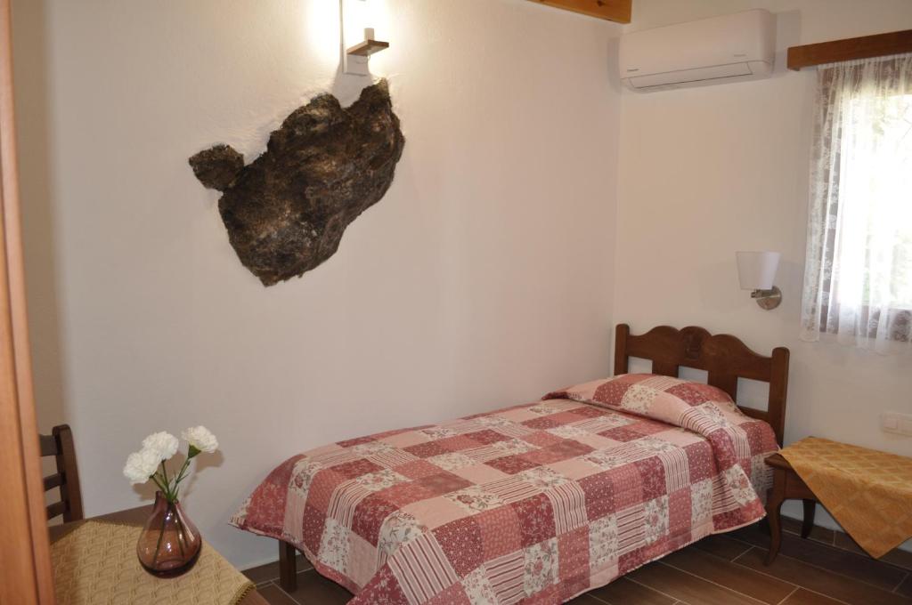 Postel nebo postele na pokoji v ubytování Vrachos Villas