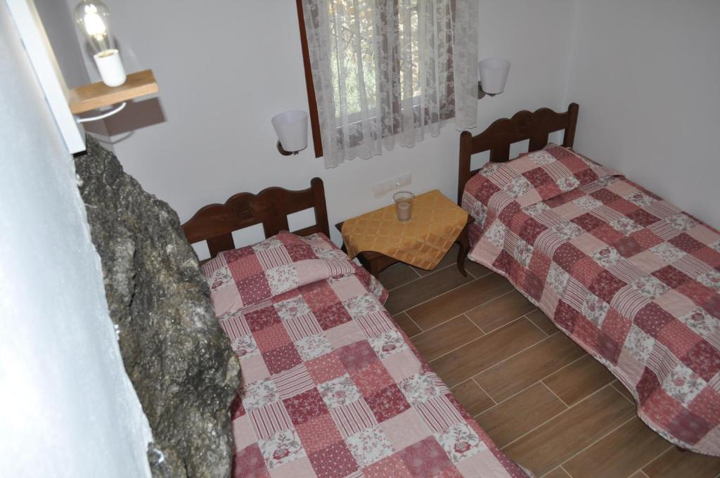 Postel nebo postele na pokoji v ubytování Vrachos Villas