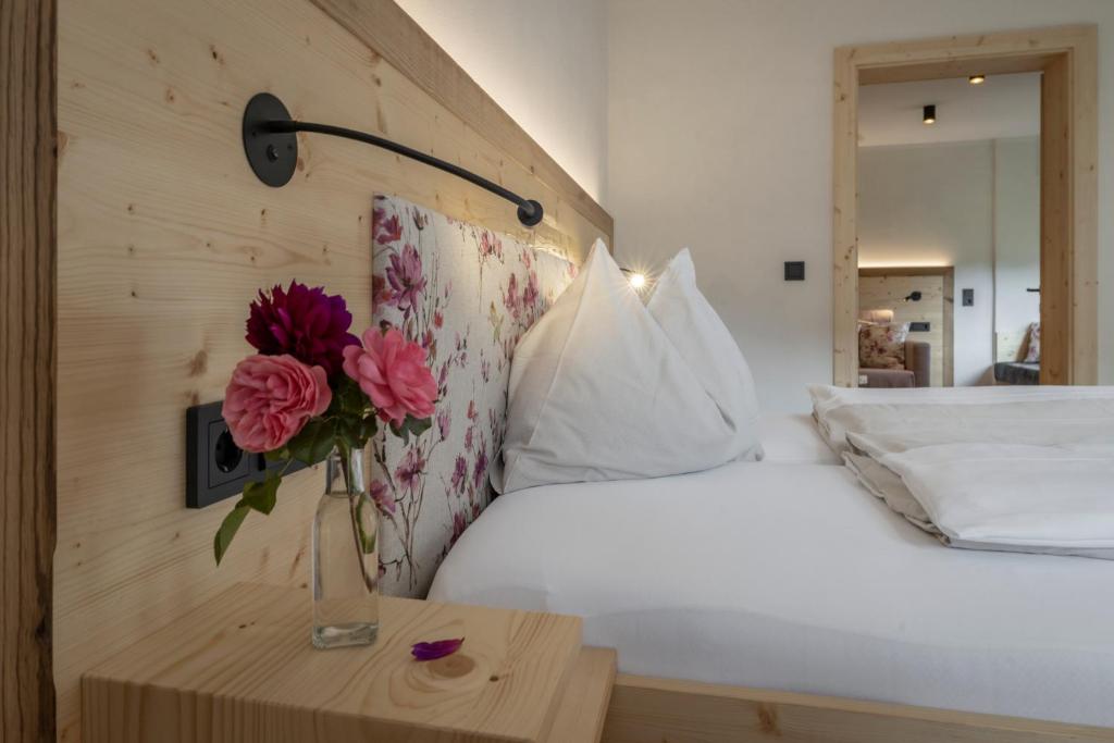 Postel nebo postele na pokoji v ubytování Hotel Winkler-Tuschnig