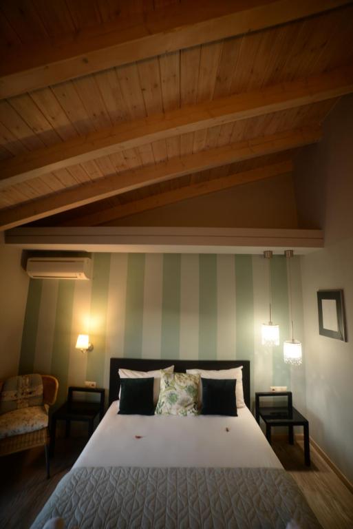 Ένα ή περισσότερα κρεβάτια σε δωμάτιο στο Grimani Pension
