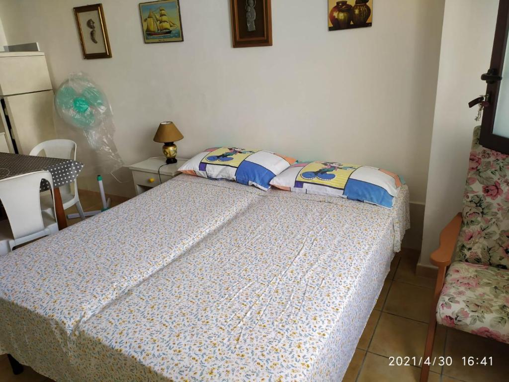 Ένα ή περισσότερα κρεβάτια σε δωμάτιο στο l'appartamentino di Romano