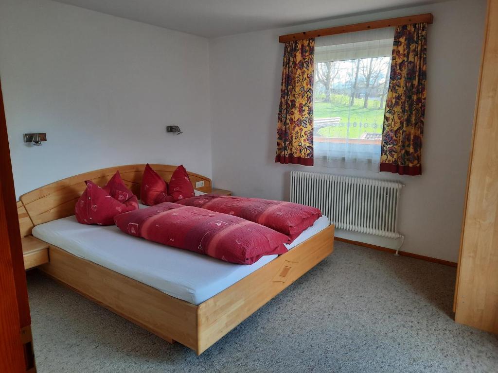 Postel nebo postele na pokoji v ubytování Grünwald Chalet