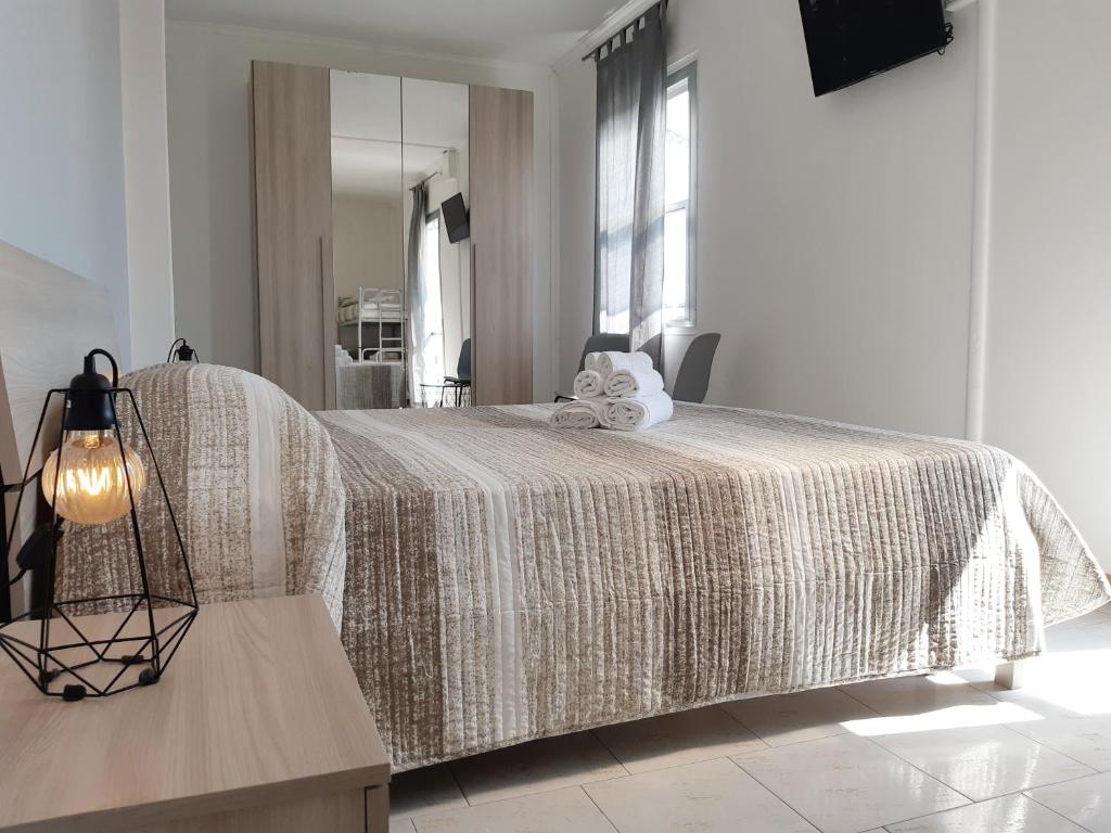 Postel nebo postele na pokoji v ubytování Hotel Mara