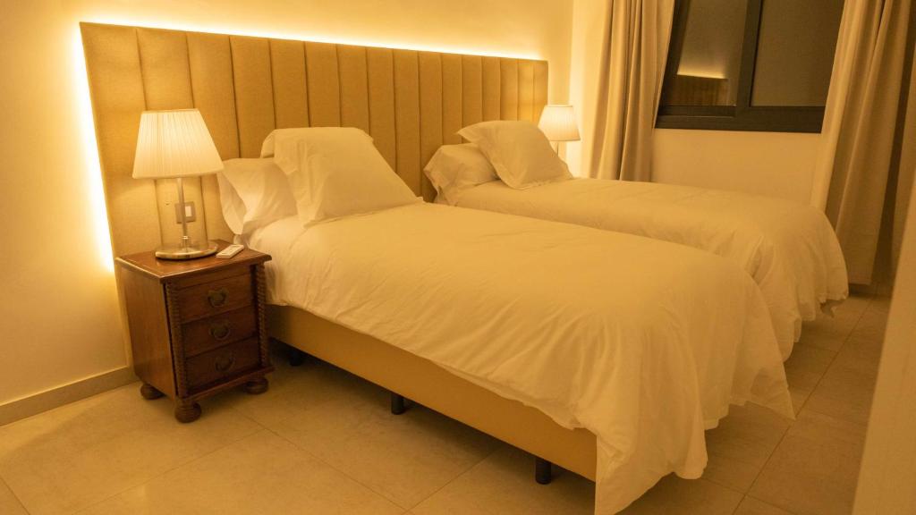 Posteľ alebo postele v izbe v ubytovaní Villa privada de lujo con piscina Villa Wabi Sabi
