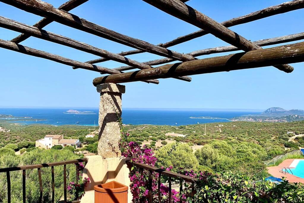 a view of the ocean from the balcony of a villa at Sunrise 23 in San Pantaleo