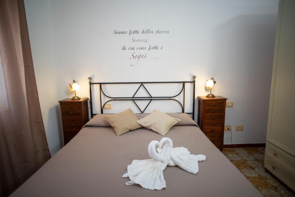 Postel nebo postele na pokoji v ubytování Poesia del Mare B&B