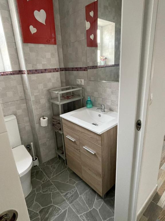 a bathroom with a sink and a toilet at Huelintown in Málaga