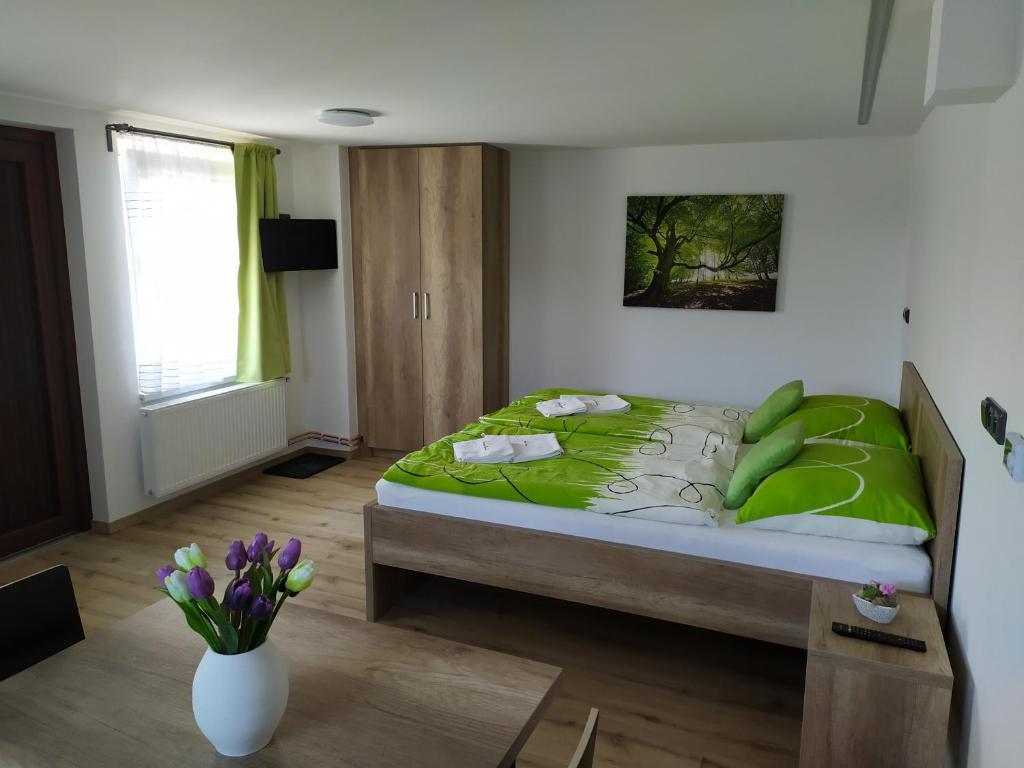 Postel nebo postele na pokoji v ubytování Penzion Burda