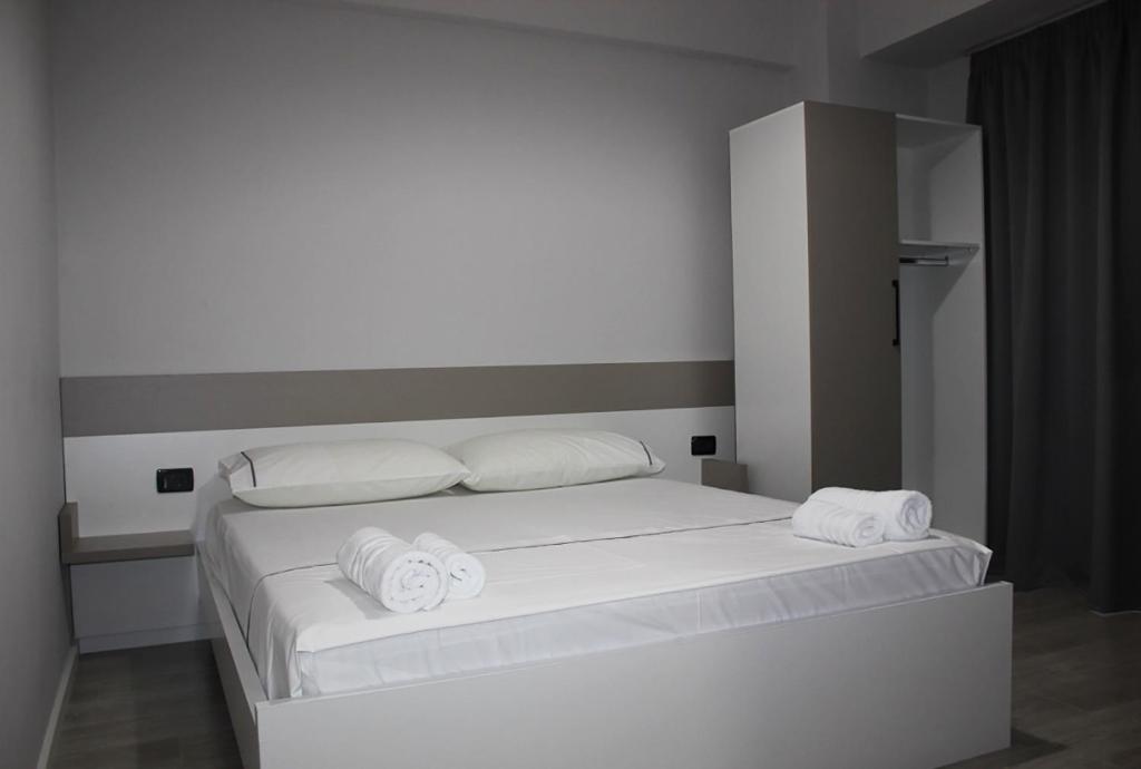 Postel nebo postele na pokoji v ubytování Hotel Cakalli