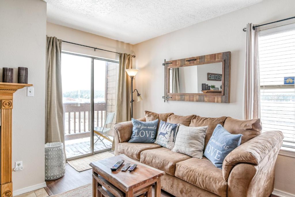 a living room with a couch and a table at Christi Villa 100 in Angel Fire