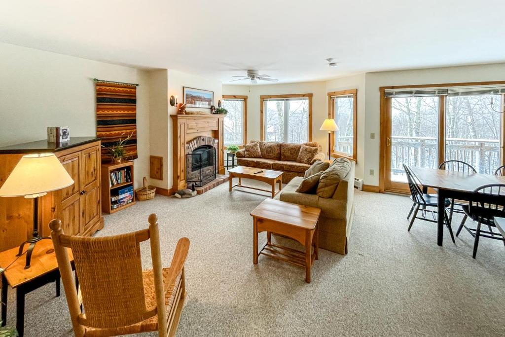 a living room with a couch and a table at Jay Peak Village Homes in Jay