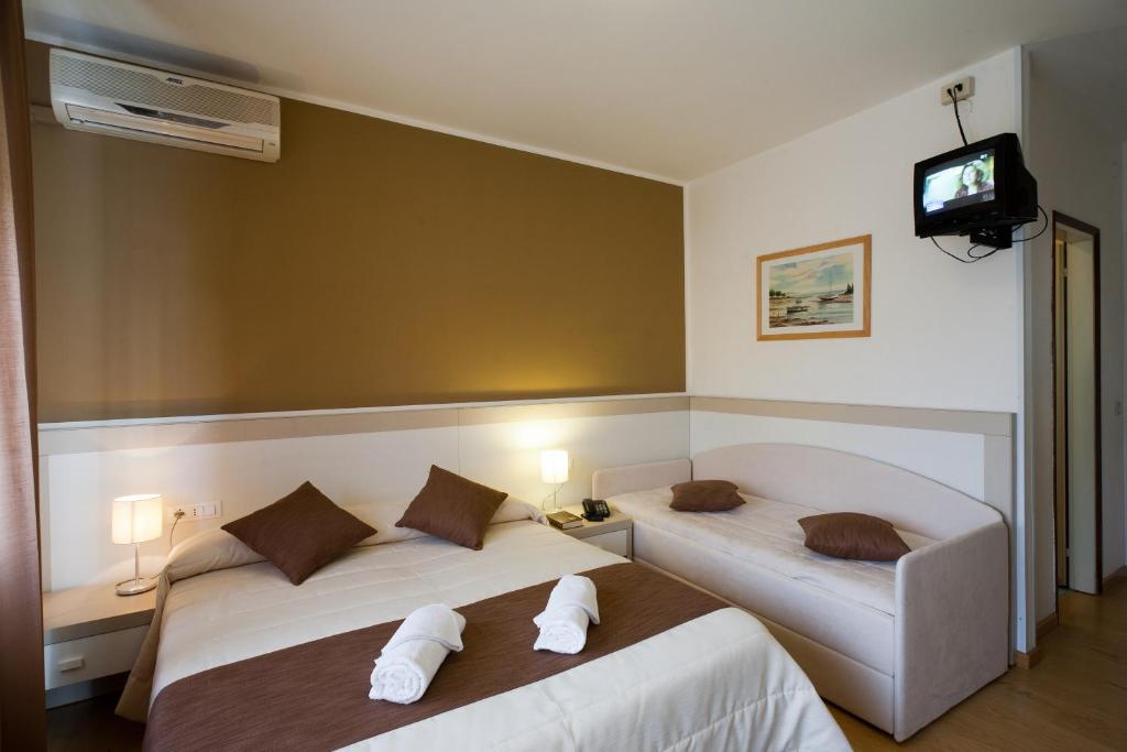 Postel nebo postele na pokoji v ubytování Hotel Canarie