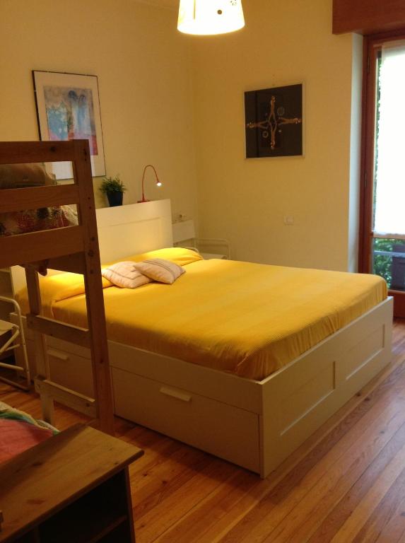 a bedroom with a bed and a ladder in it at B&B Le Ortensie -Lago di Como in Lierna