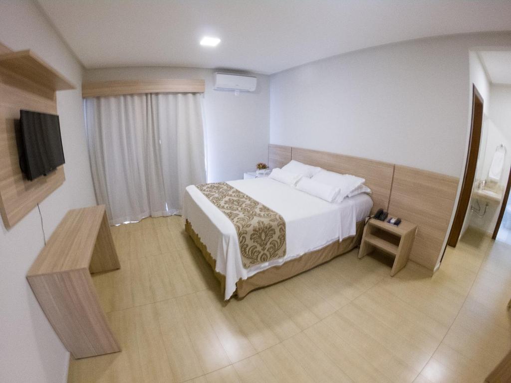Postel nebo postele na pokoji v ubytování Le Parc Hotel