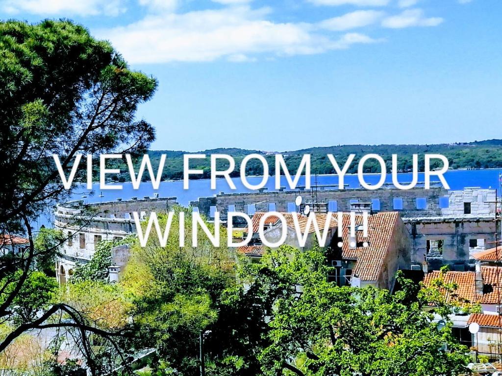 a view of a city with the words view from your window at Pula Center Arena Belvedere Apartments and Rooms in Pula
