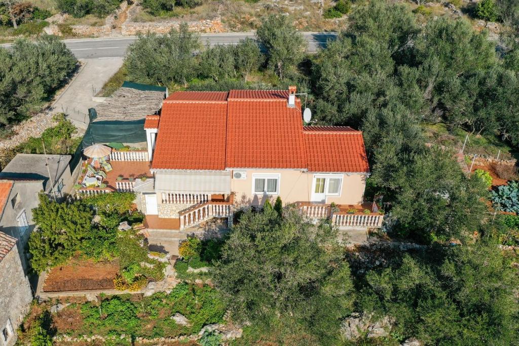 an overhead view of a house with an orange roof at Apartments Tara - 70 m from beach in Brbinj