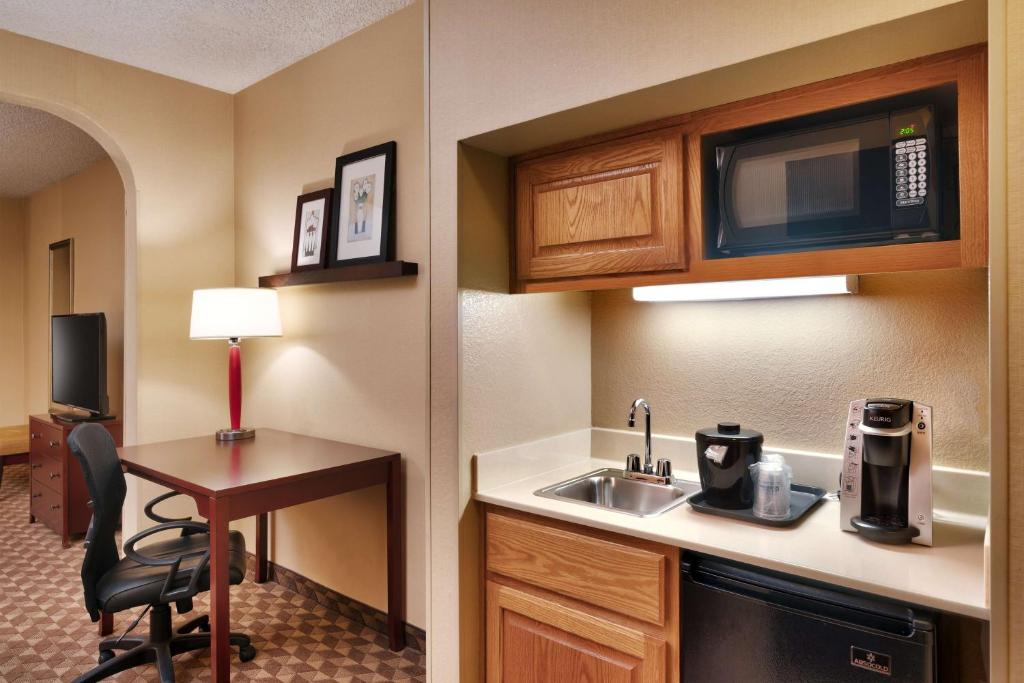 a kitchen with a sink and a desk in a hotel room at Best Western Downtown Phoenix in Phoenix