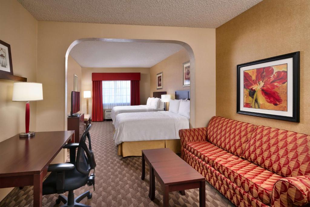 a hotel room with a bed and a couch at Best Western Downtown Phoenix in Phoenix