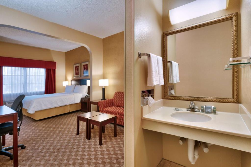 a hotel room with a bathroom with a bed and a sink at Best Western Downtown Phoenix in Phoenix