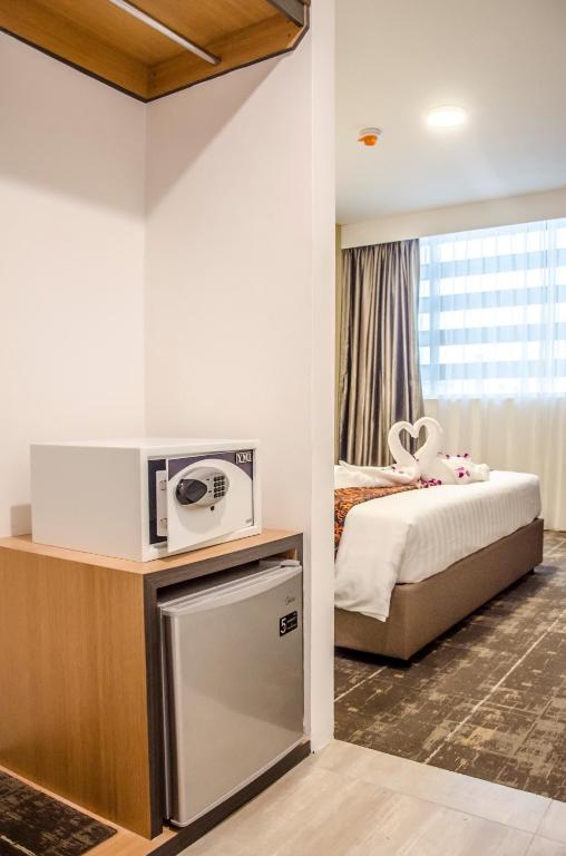 Postel nebo postele na pokoji v ubytování Hotel 7 Suria