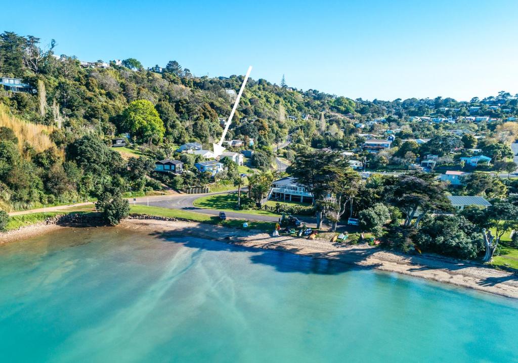 an aerial view of a river with houses at Bluebelle - Stay Waiheke in Oneroa