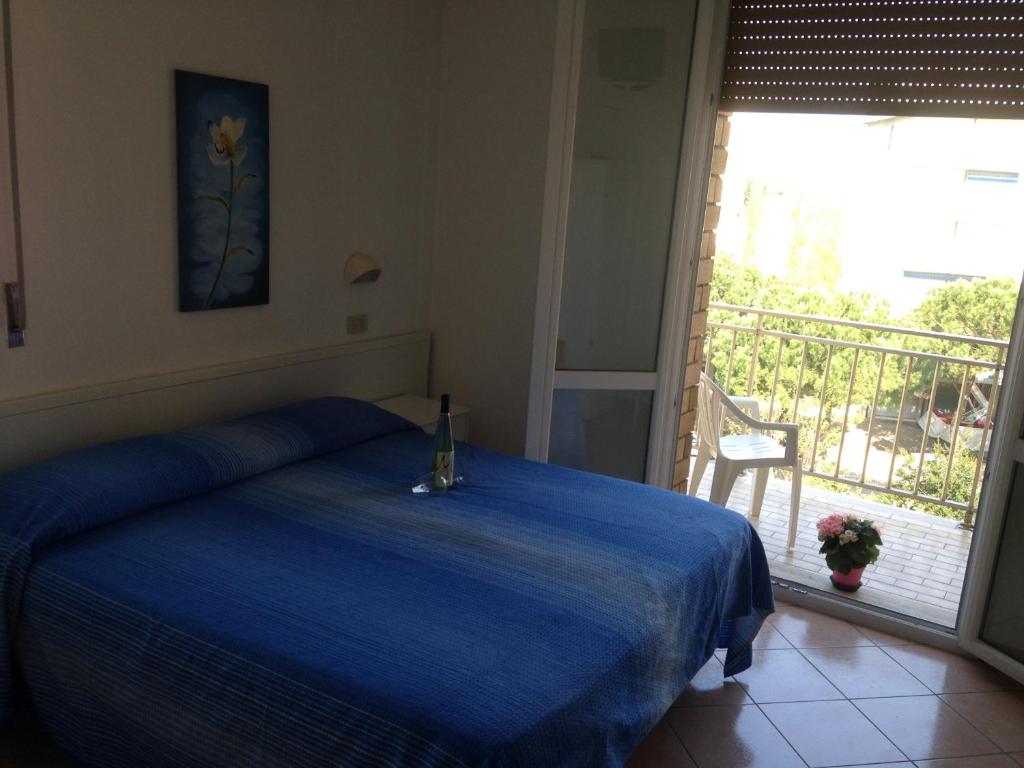 Postel nebo postele na pokoji v ubytování Hotel Primula