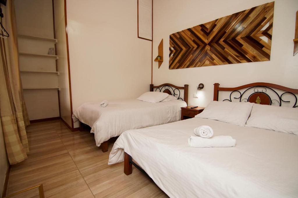 Postel nebo postele na pokoji v ubytování Finca Hotel Yerbabuena