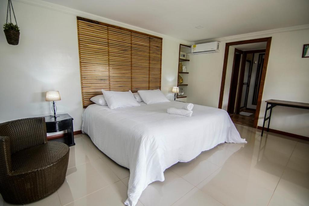Postel nebo postele na pokoji v ubytování Finca Hotel Yerbabuena