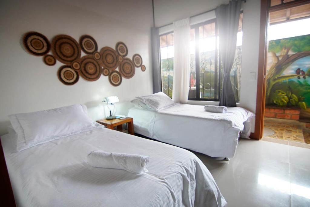 Postel nebo postele na pokoji v ubytování Finca Hotel Yerbabuena