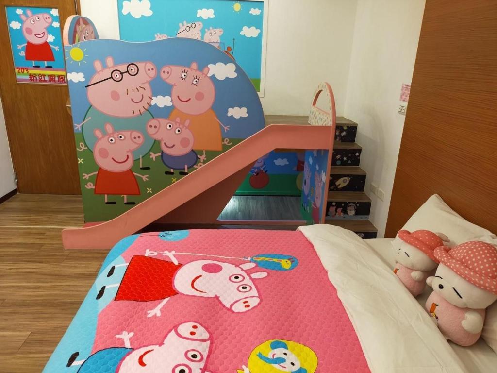 a childs bedroom with a bed with a sheep crib at Happy Castle Cottage in Hualien City