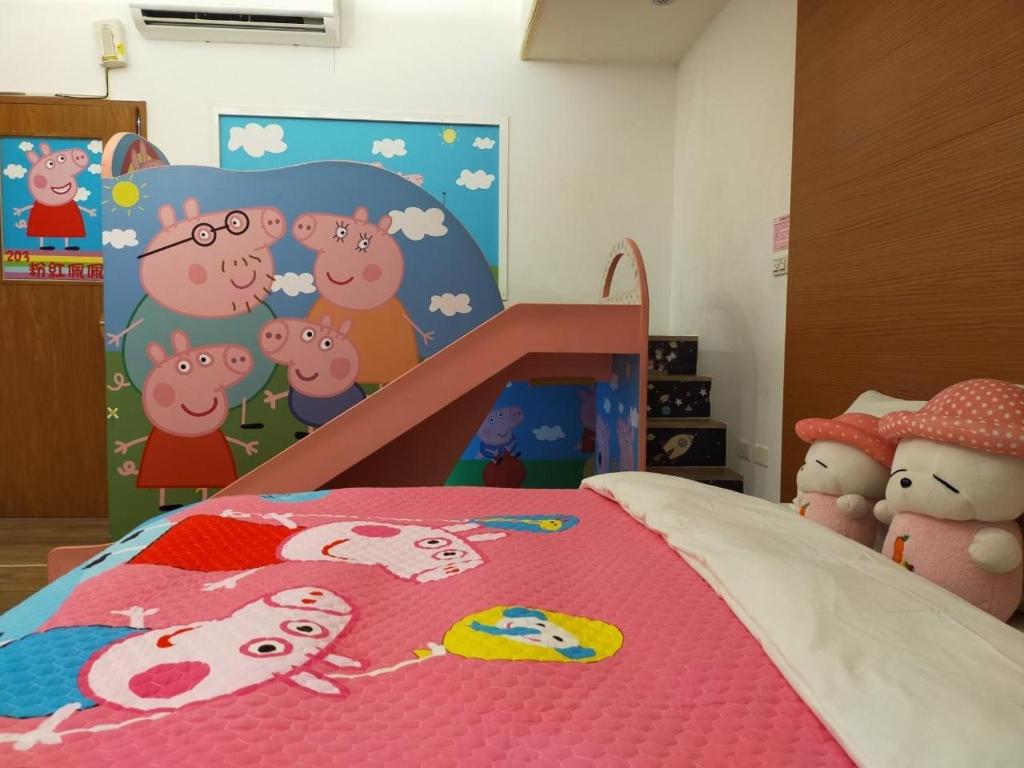 a bedroom with a bed with a bedspread with cows on it at Happy Castle Cottage in Hualien City