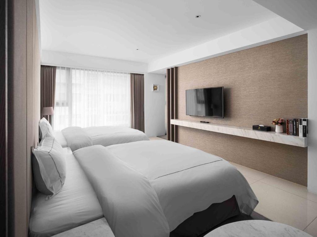 Postel nebo postele na pokoji v ubytování Gamalan Spring Hotel