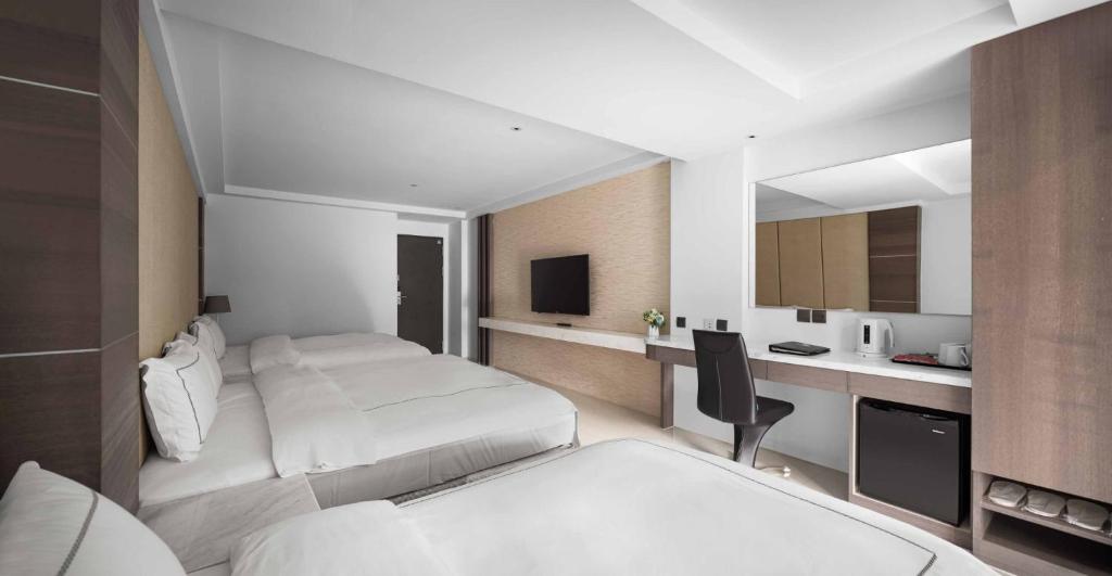 Postel nebo postele na pokoji v ubytování Gamalan Spring Hotel