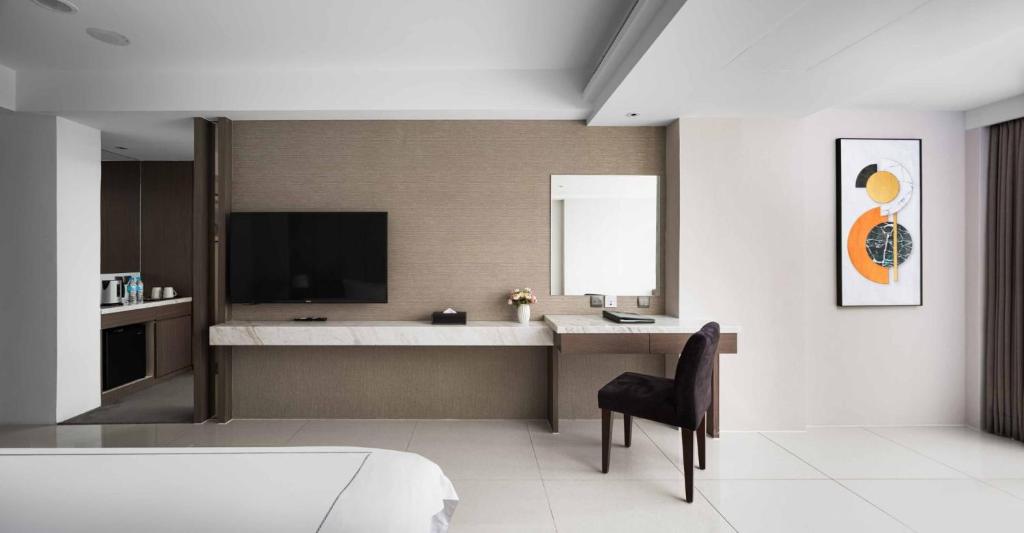 TV a/nebo společenská místnost v ubytování Gamalan Spring Hotel
