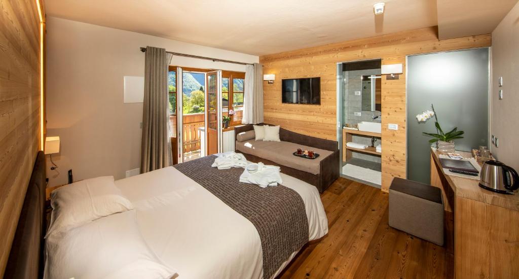 Postel nebo postele na pokoji v ubytování Albergo Edelweiss - LareSpa