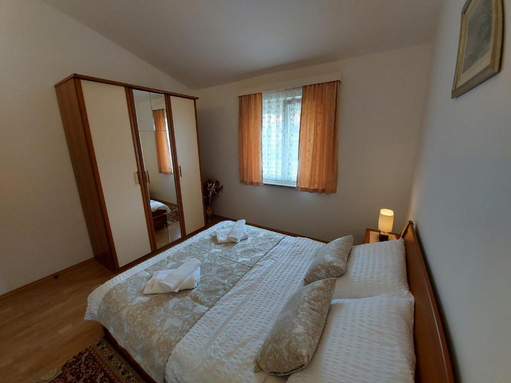 Posteľ alebo postele v izbe v ubytovaní Apartments Palić