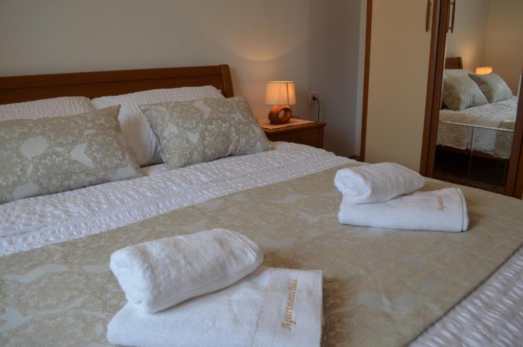 Posteľ alebo postele v izbe v ubytovaní Apartments Palić