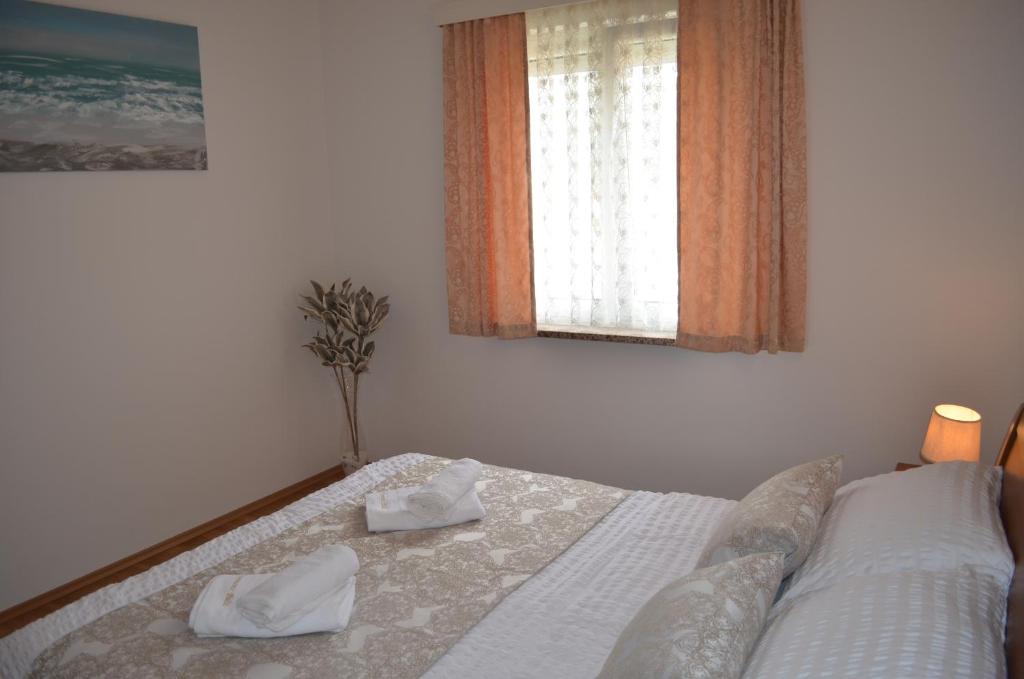Posteľ alebo postele v izbe v ubytovaní Apartments Palić