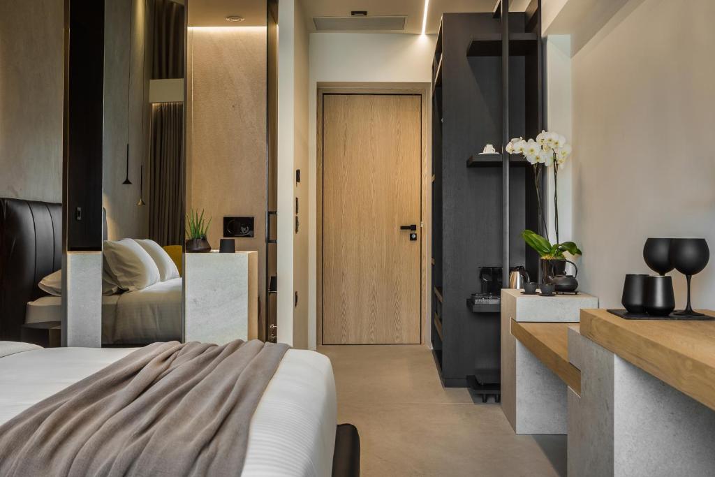Postel nebo postele na pokoji v ubytování Canale Hotel & Suites