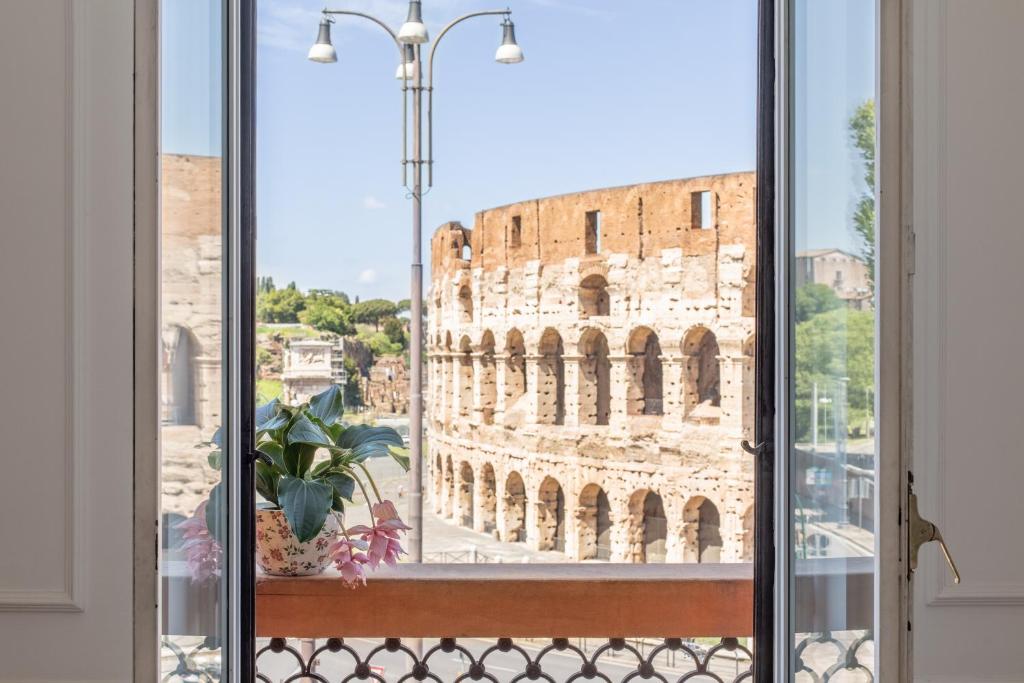 a view from a window of the coliseum at iFlat Unforgettable in front of Colosseum in Rome