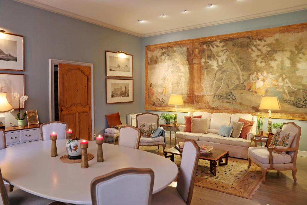 a living room with a table and a couch at Chambres d'hôtes La Tour Sainte-Cécile in Albi