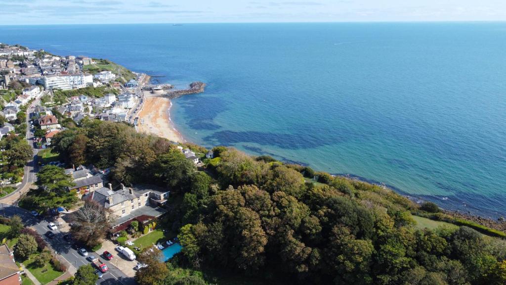an aerial view of a beach and the ocean at The Eversley B&B in Ventnor