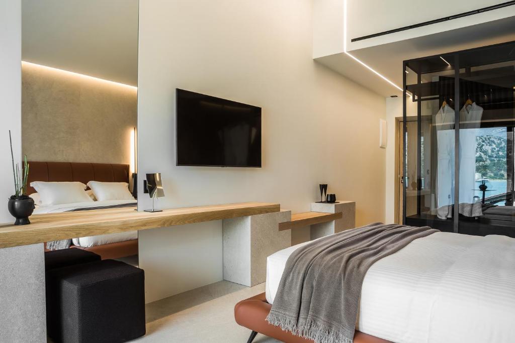 Postel nebo postele na pokoji v ubytování Canale Hotel & Suites