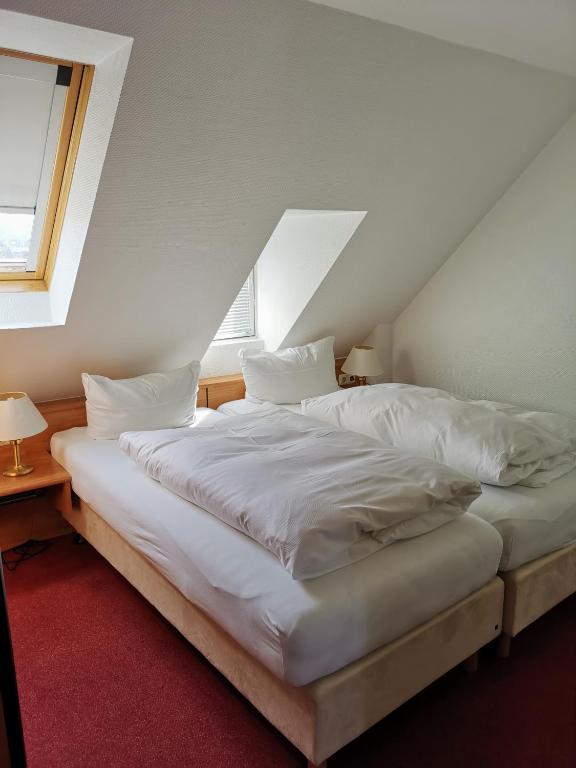 Postel nebo postele na pokoji v ubytování Zum Winzermännle